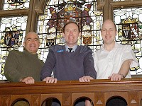 Padre Richard Lee (centre), the new Principal of the Armed Forces' Chaplaincy Centre, with Army colleague, the Rev. Steve Parselle (left) and the Royal Navy's Rev Martyn Gough personify the Tri-service nature of the Centre.  They are framed by one of Amport House's most important features, the painted (not stained) glazing of the grand staircase