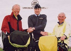 L-R, David Williams, Flt Lt Dan Gray (RAF Kinloss) and Min Larkin at the end of the 1,032 mile cycle ride