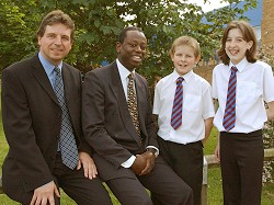 Pictured from left: Beaufort Community School headteacher Malcolm Bride and Air Commodore David Case chat to two of the year seven prize-winners at the Governors’ Presenation Evening – Daniel Ireland, 12, from Tuffley, who received a prize for English and Natasha Pursey, also 12, who received a prize for Science