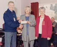 Viv Glover and Diane Hawkins accept the cheque