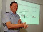 Squadron Leader Dave Curwen uses a visual aid to demonstrate some of the theory of helicopter flight