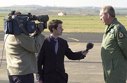Station Commander at RAF Valley, Gp Capt Les Garside-Beattie, faces the media