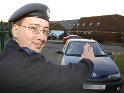 Stop: Corporal Neil Blackwell from Headquarters Personnel and Training Command, Royal Air Force Innsworth, puts his idea to improve child safety at Field Court Infants School in to practice. By preventing unauthorised cars from entering the ground of the school at peek times of activity it is hoped to protect the children from being knocked down or injured.