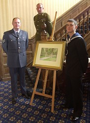 The tri-service presentation team with the painting