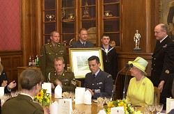 Sgt Stannard and the team present the painting to Her Majesty