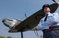 Station Commander at Royal Air Force Uxbridge, Group Captain PJ Hughesdon with the Spitfire