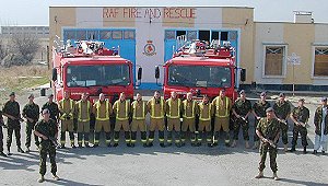 The RAF firefighters in Kabul. WO Pittock is front right of the group, in front of the line of firemen and RAF Regiment personnel